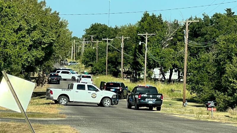 Multiple law enforcement agencies are surrounding a home on West Anderson Avenue in Waurika...